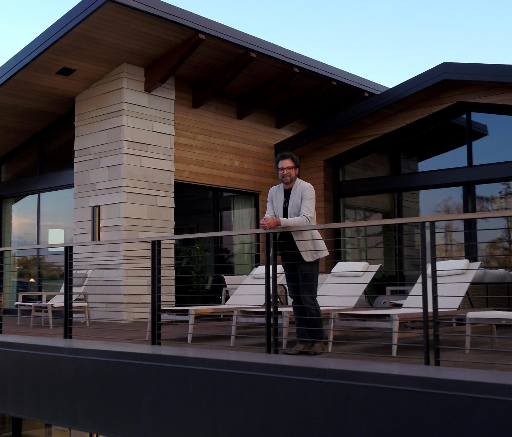 Winn Wittman on a residence terrace at dusk