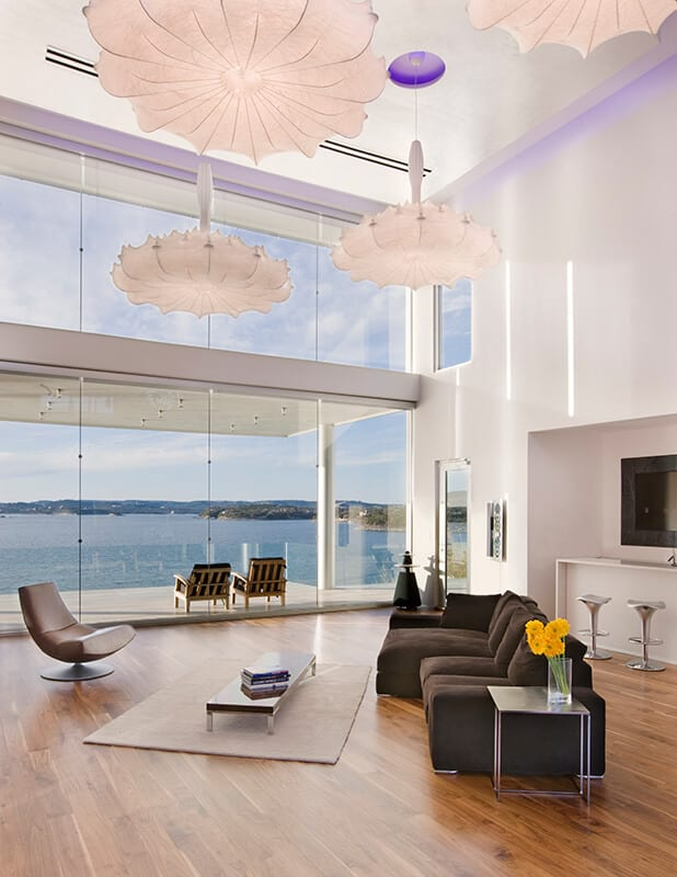 Wittman interior with sculptural pendants overlooking lake